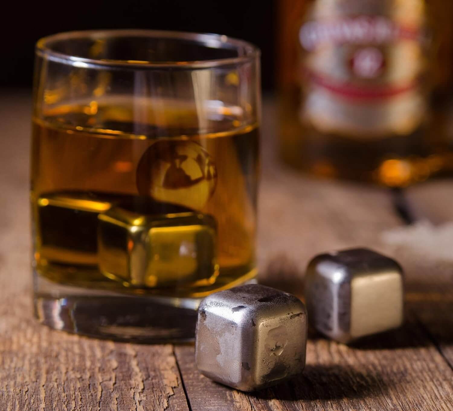 whiskey stones gift set for men featuring stainless steel ice cubes in a glass of whiskey