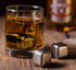 whiskey stones gift set for men featuring stainless steel ice cubes in a glass of whiskey